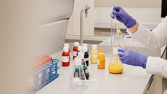 Laboratory technician testing chemicals