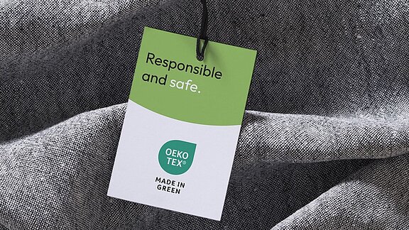 Grey fabric with a MADE IN GREEN hangtag